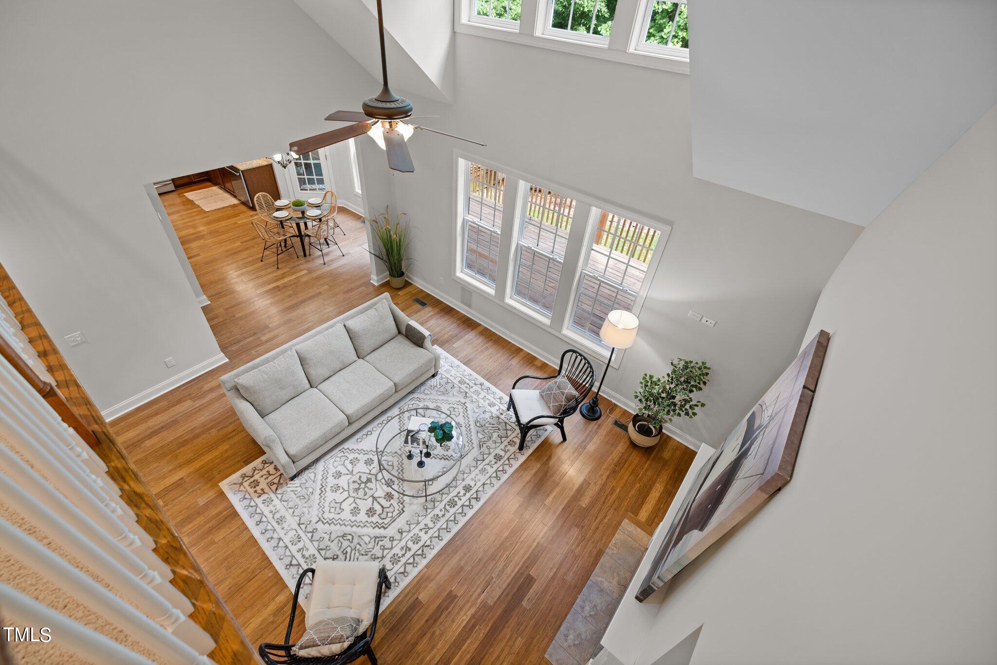 152 Roads End Pittsboro, NC 27312 - Photo 9 of 58 a living room with furniture and a wooden floor