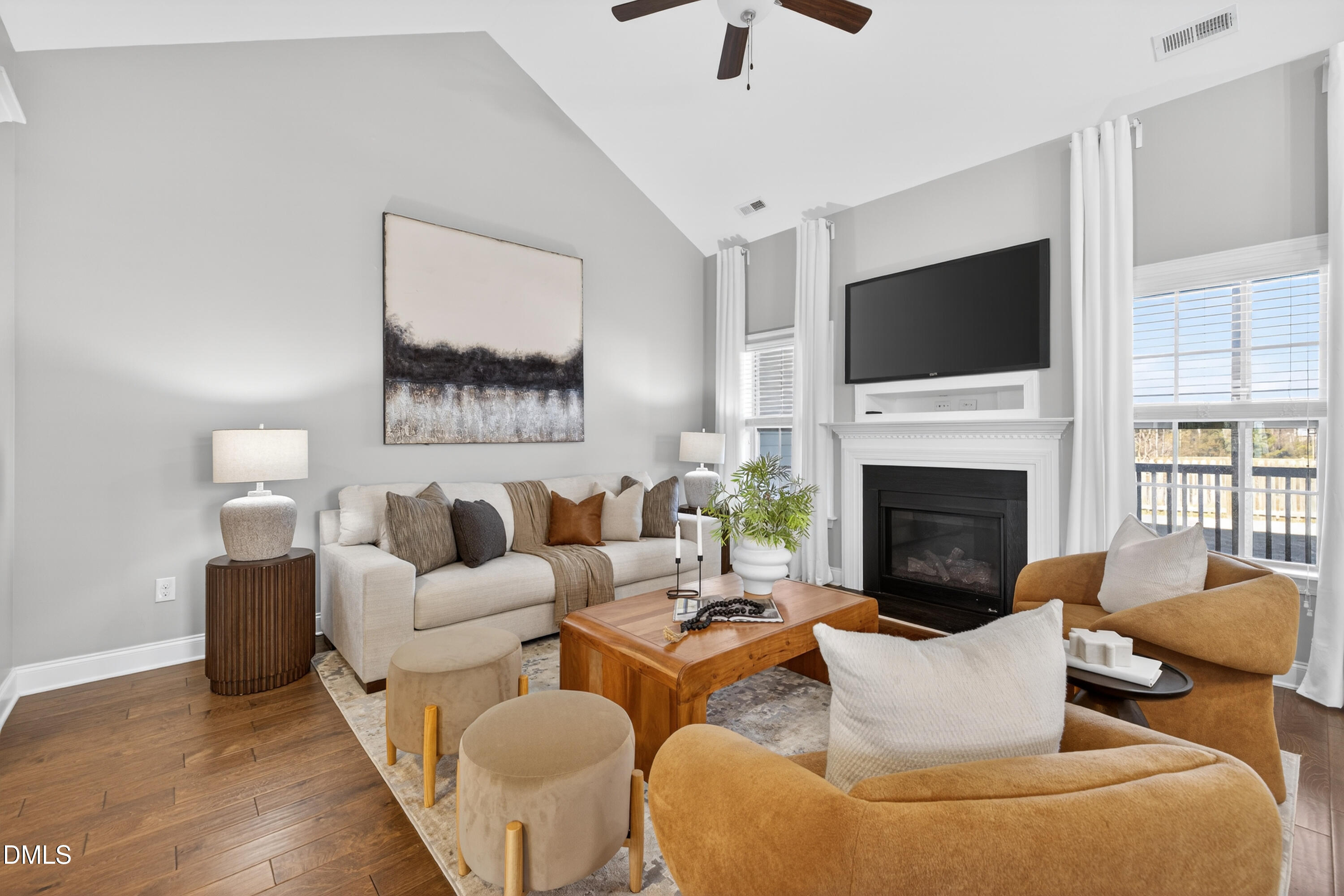 5248 Copain Cove Fuquay-Varina, NC 27526 - Photo 9 of 47 a living room with furniture fireplace and a flat screen tv