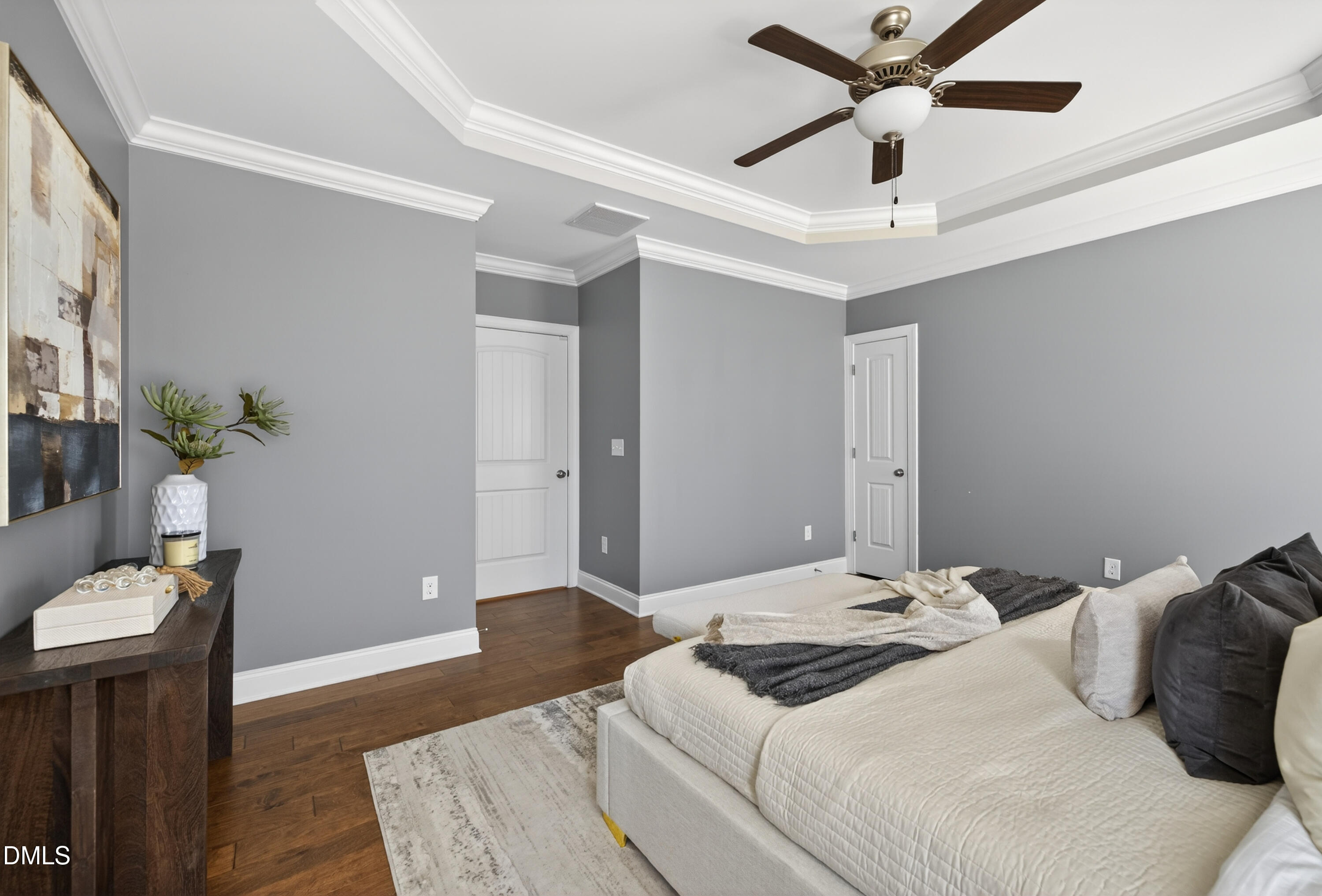 5248 Copain Cove Fuquay-Varina, NC 27526 - Photo 17 of 47 a bedroom with a bed and a chandelier