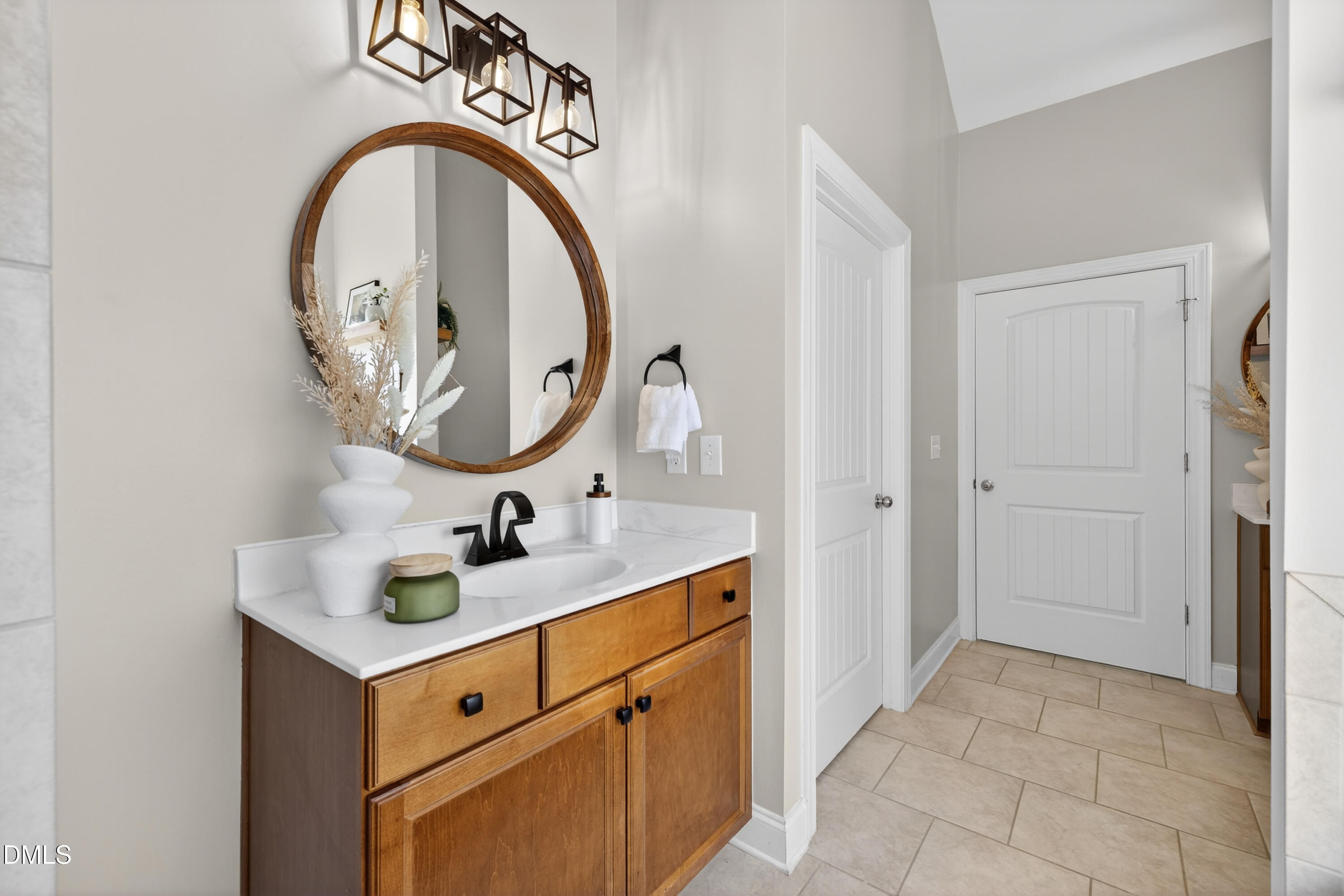 5248 Copain Cove Fuquay-Varina, NC 27526 - Photo 18 of 47 a bathroom with a sink and a mirror