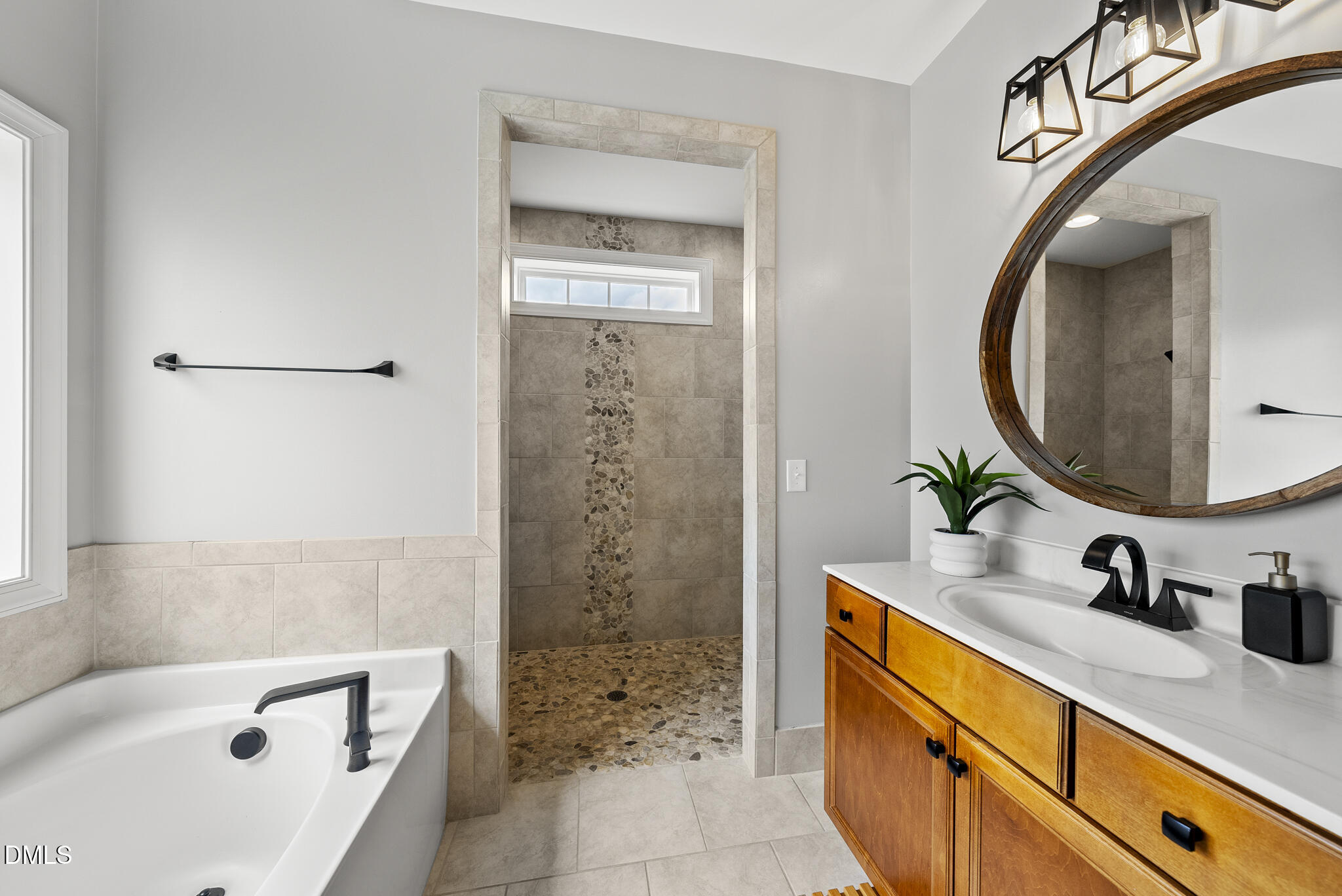 5248 Copain Cove Fuquay-Varina, NC 27526 - Photo 19 of 47 a bathroom with a sink and a mirror