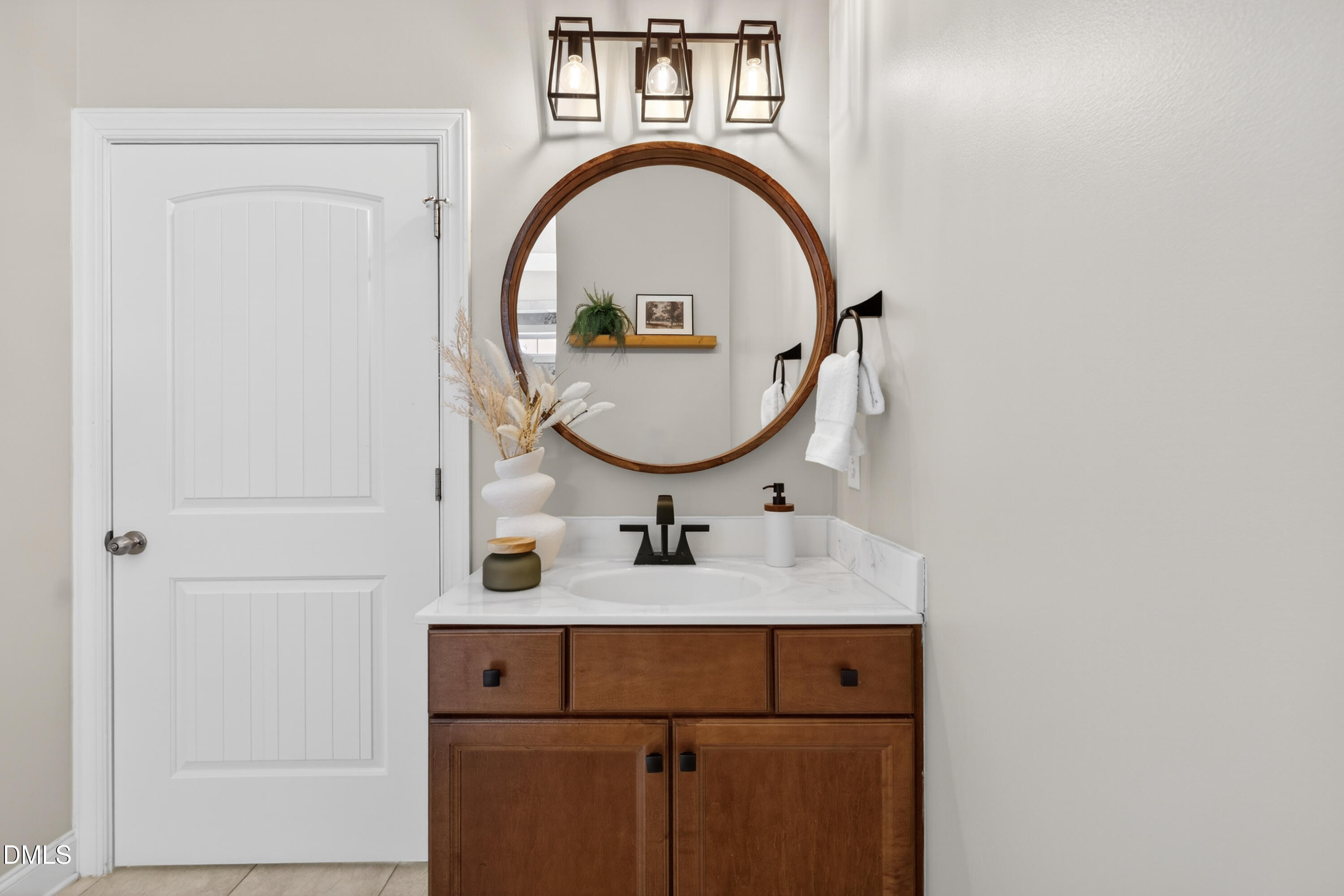 5248 Copain Cove Fuquay-Varina, NC 27526 - Photo 20 of 47 a bathroom with a sink and a mirror