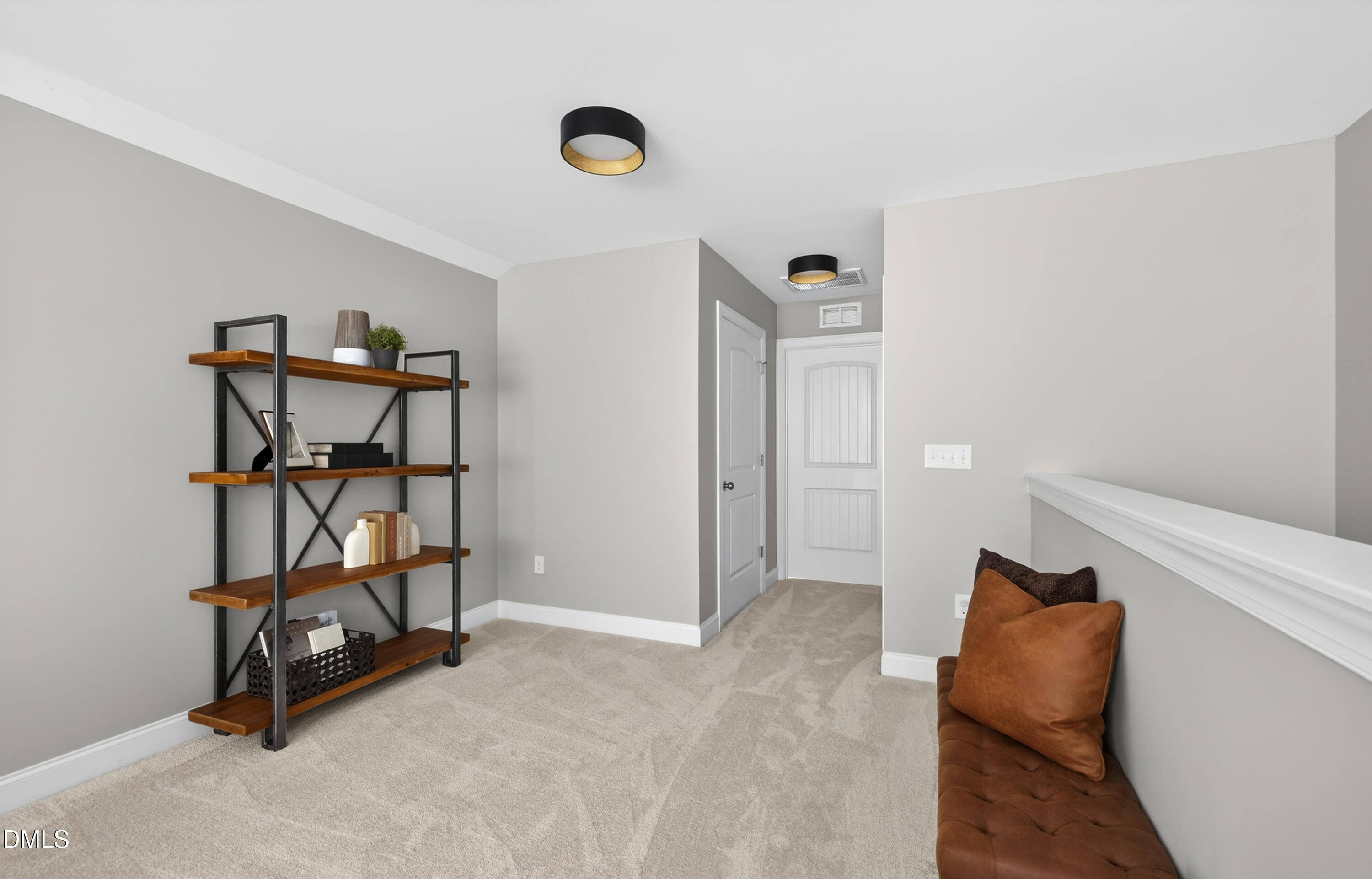 5248 Copain Cove Fuquay-Varina, NC 27526 - Photo 24 of 47 a view of a room with racks on the wall