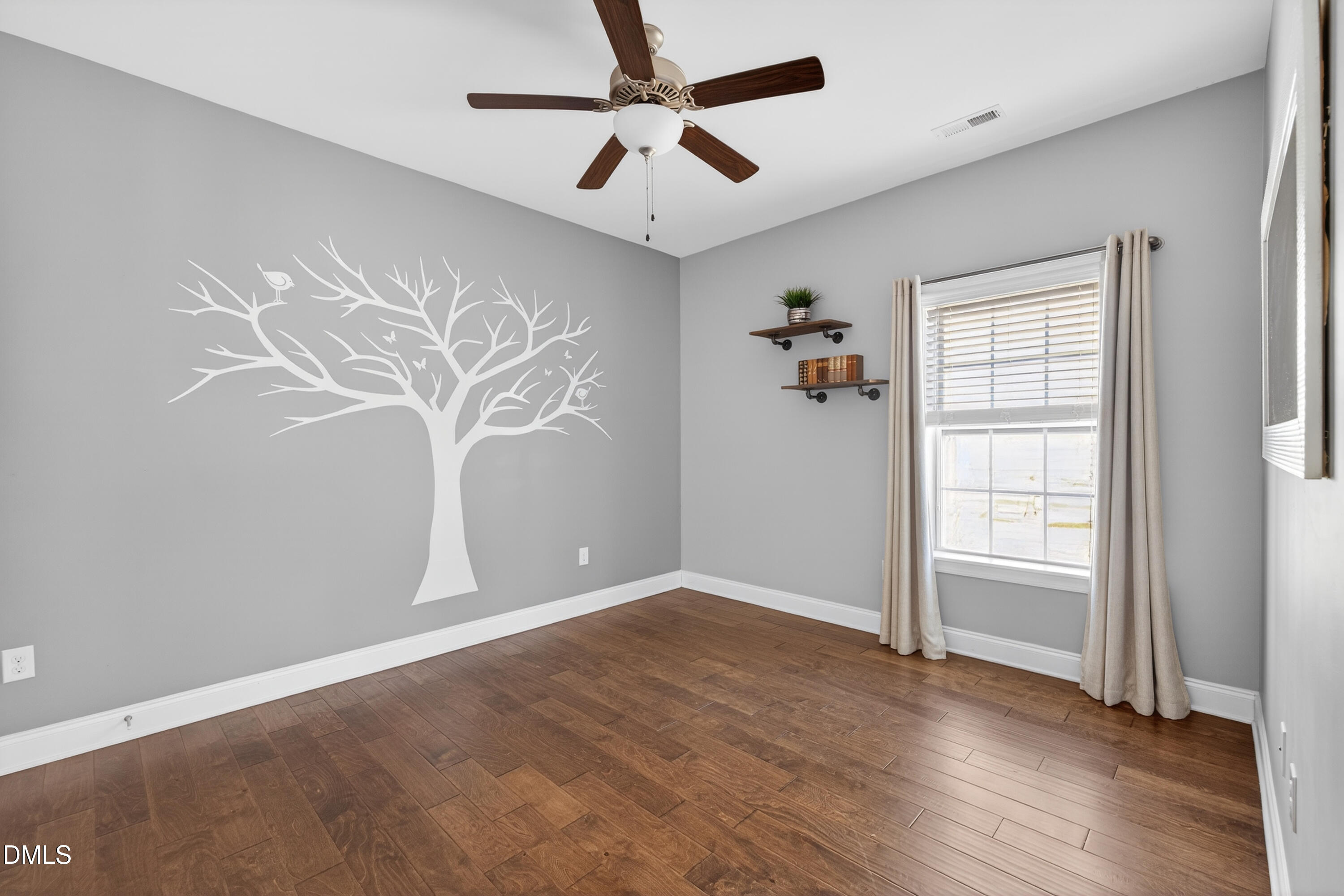 5248 Copain Cove Fuquay-Varina, NC 27526 - Photo 31 of 47 an empty room with wooden floor chandelier fan and windows