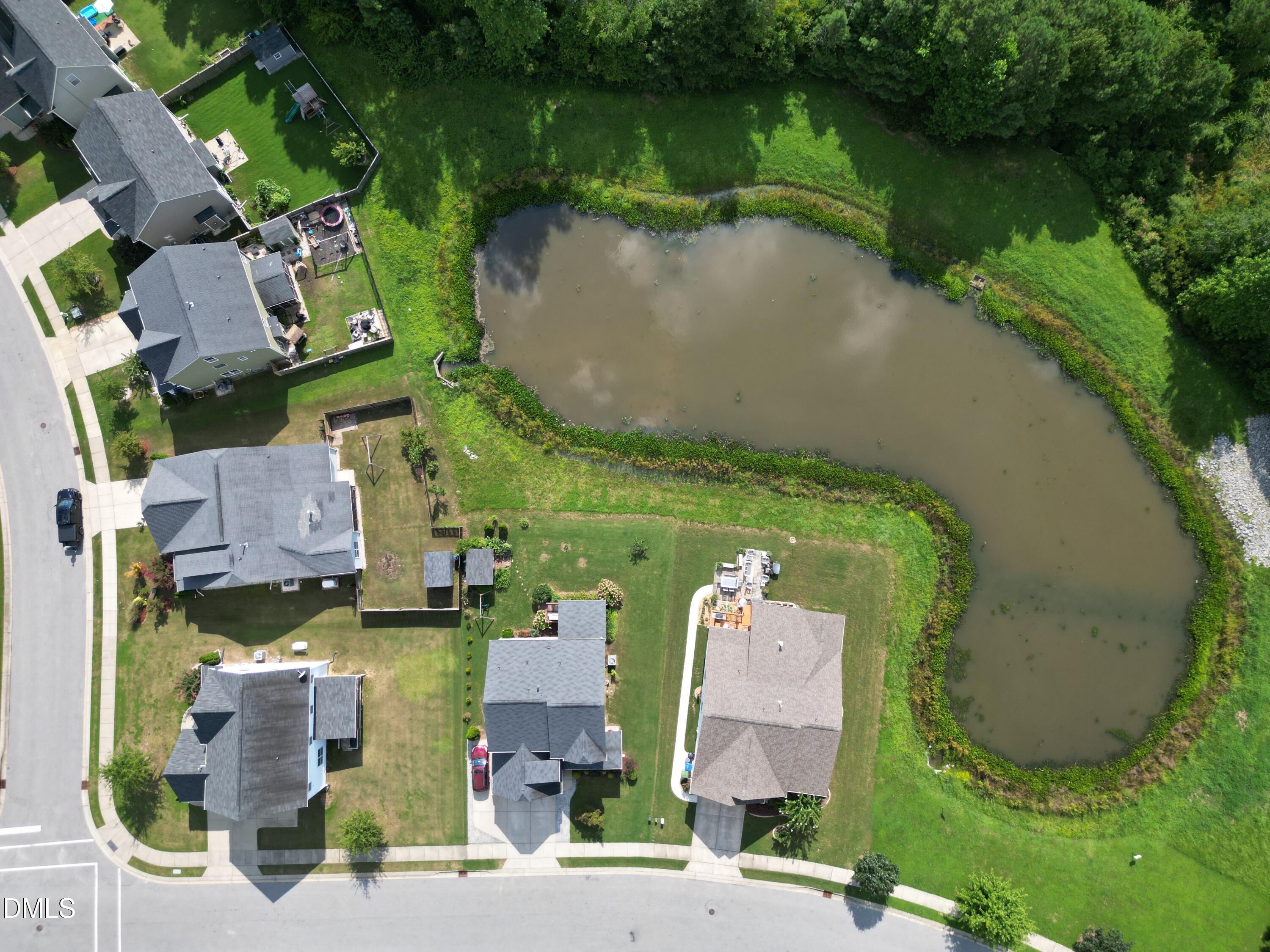 5248 Copain Cove Fuquay-Varina, NC 27526 - Photo 43 of 47 an aerial view of residential house with outdoor space and lake view