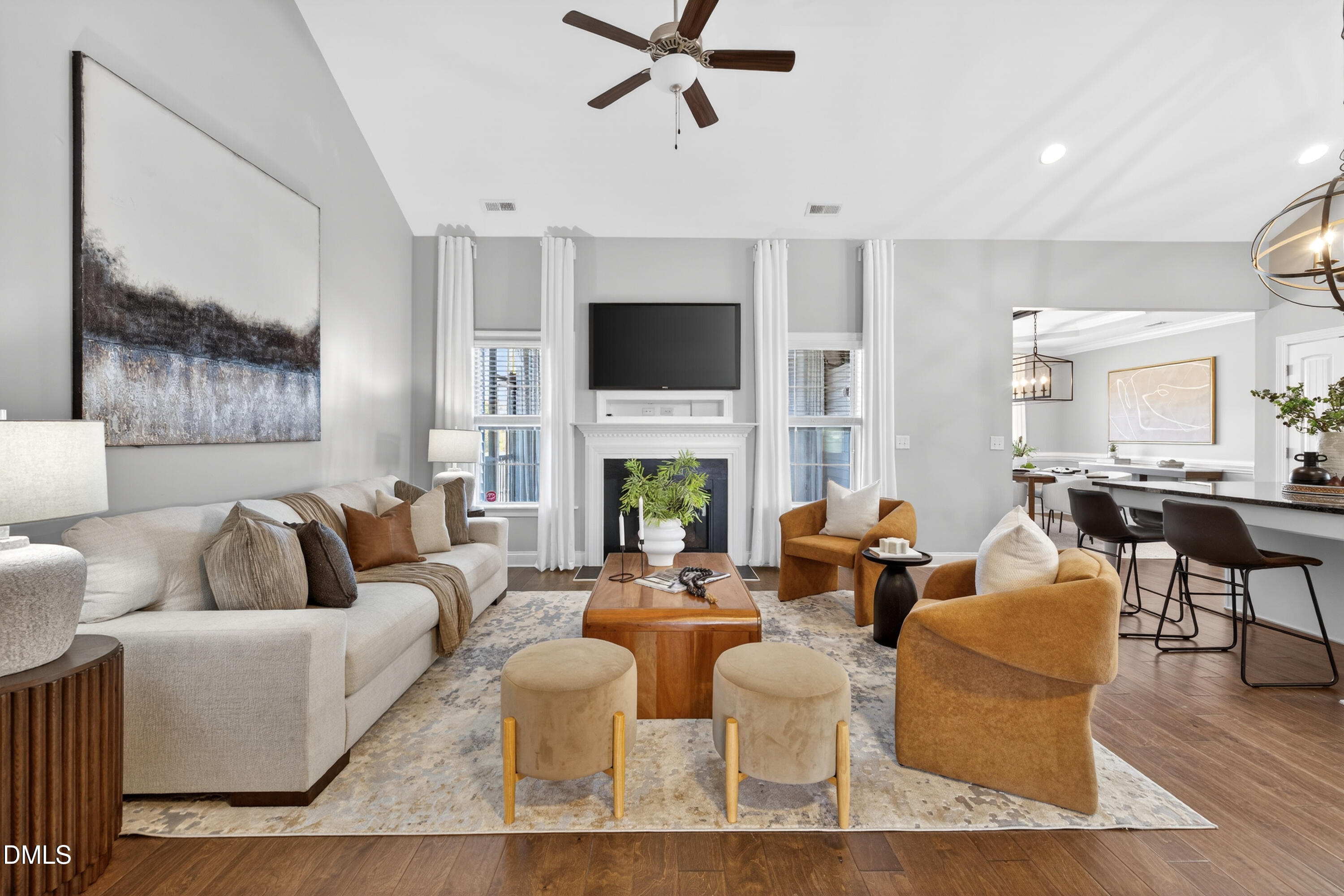 5248 Copain Cove Fuquay-Varina, NC 27526 - Photo 3 of 47 a living room with fireplace furniture and a flat screen tv