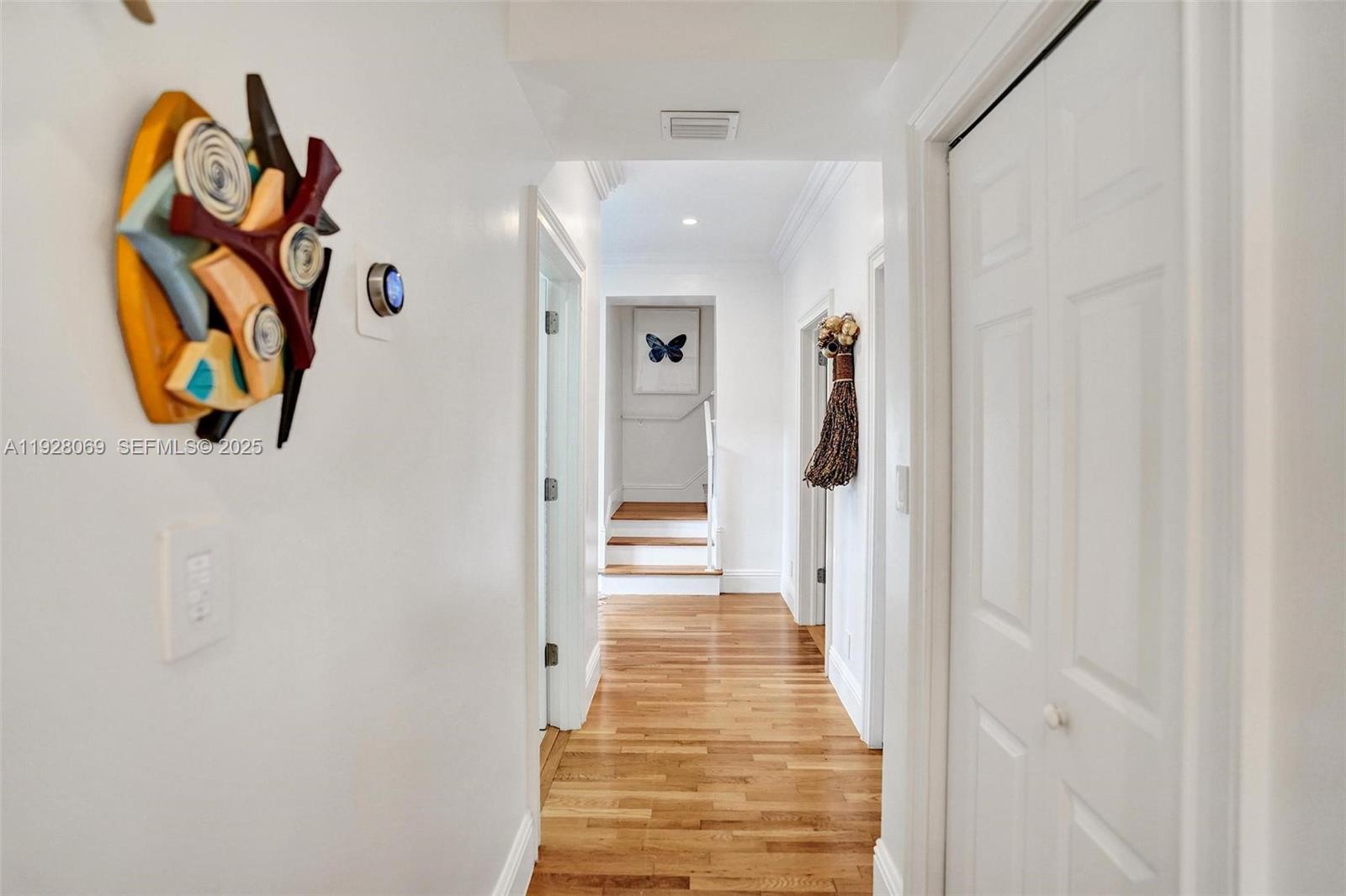 1281 Banyan Road Boca Raton, FL 33432 - Photo 36 of 69 a view of a hallway with wooden floor and entryway