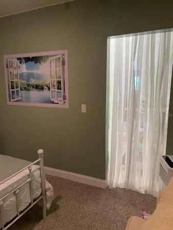 a room with a bed and a window
