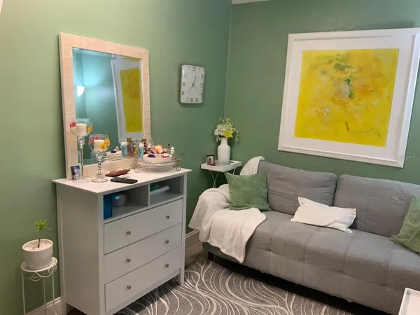 a bedroom with a bed and dresser