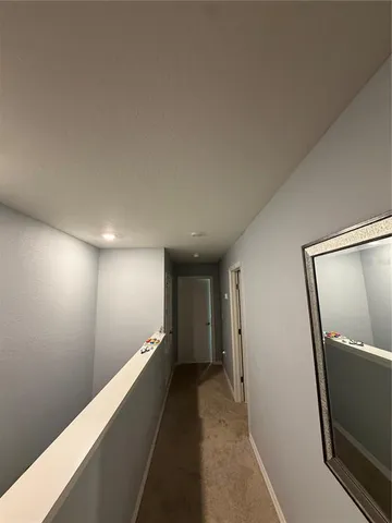 a view of hallway with stairs