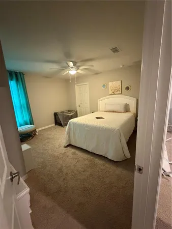 a bedroom with a bed and a mirror