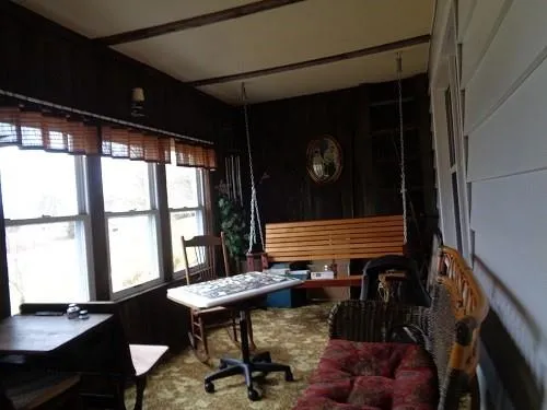 a view of a livingroom with furniture and window