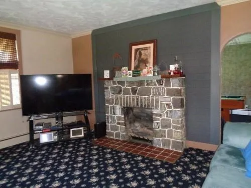 a room with furniture and a flat screen tv