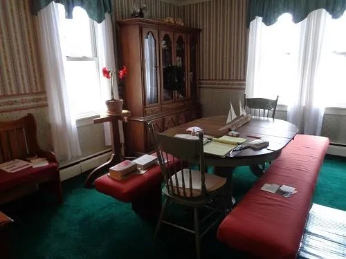 a view of a dining room with furniture and window