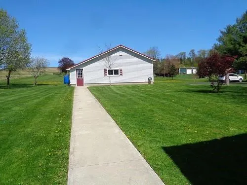 a view of a house with a yard