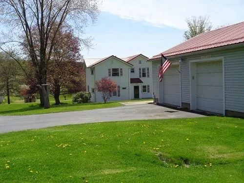 a view of a house with a yard