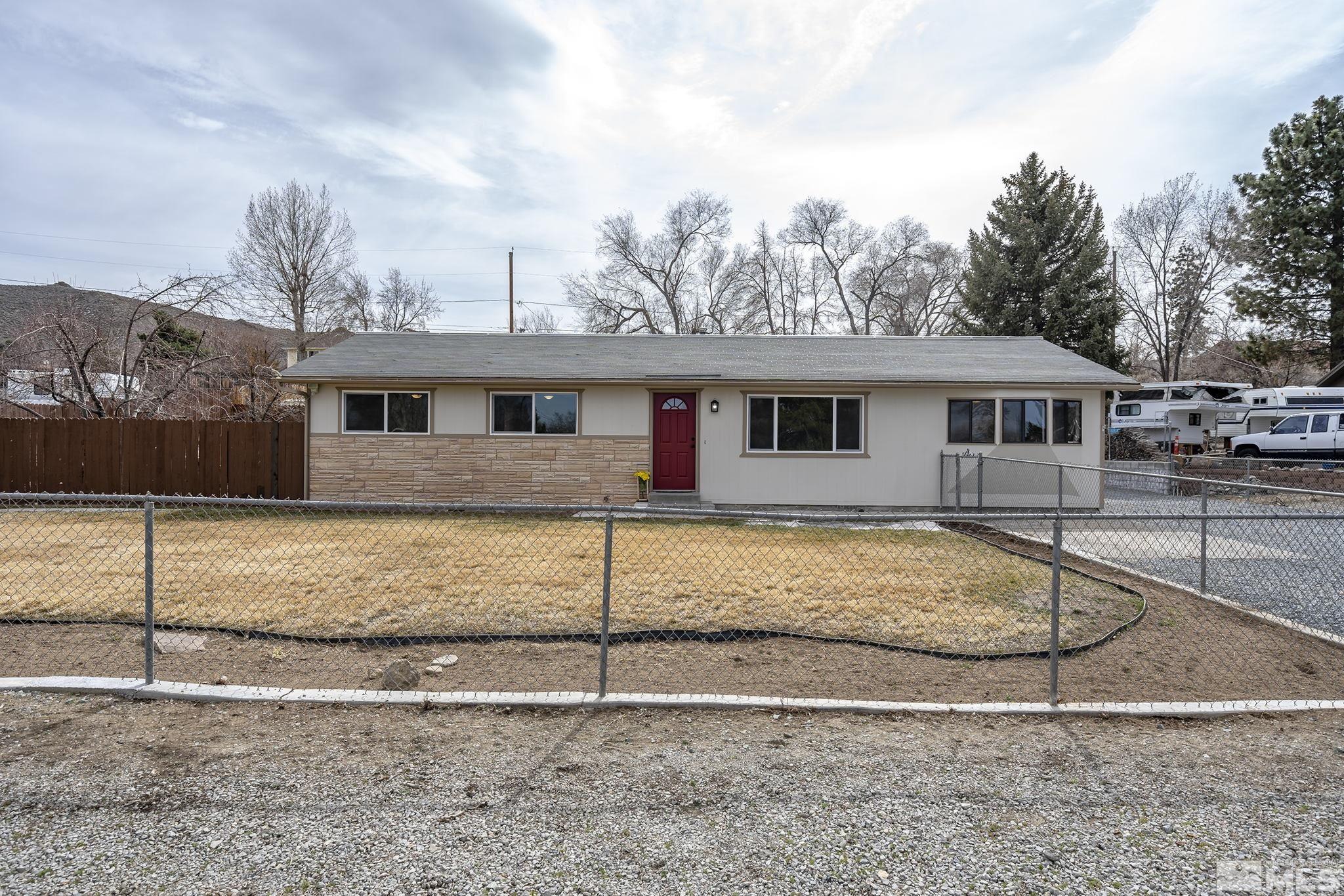 8895 Limnol Street Reno, NV 89506 - Photo 1 of 21 a front view of a house with a yard