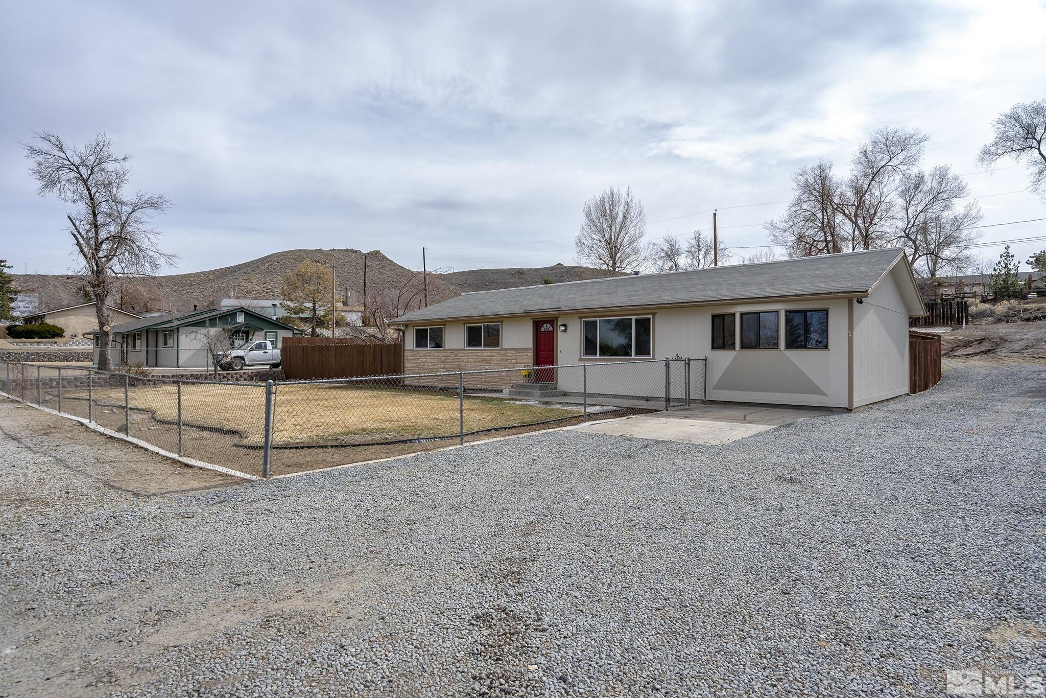 8895 Limnol Street Reno, NV 89506 - Photo 2 of 21 a view of a house with a yard