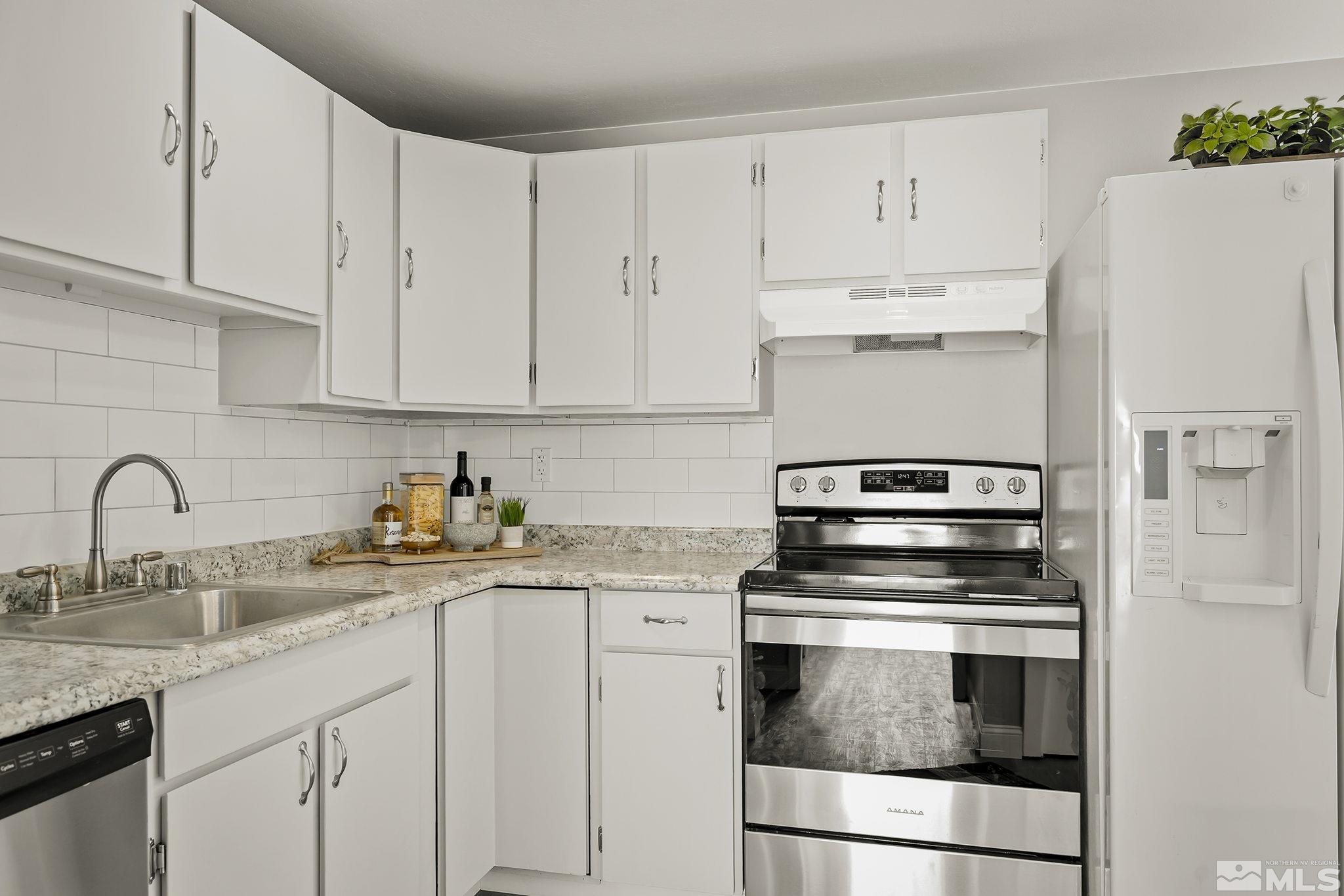 8895 Limnol Street Reno, NV 89506 - Photo 7 of 21 a kitchen with cabinets appliances and a sink