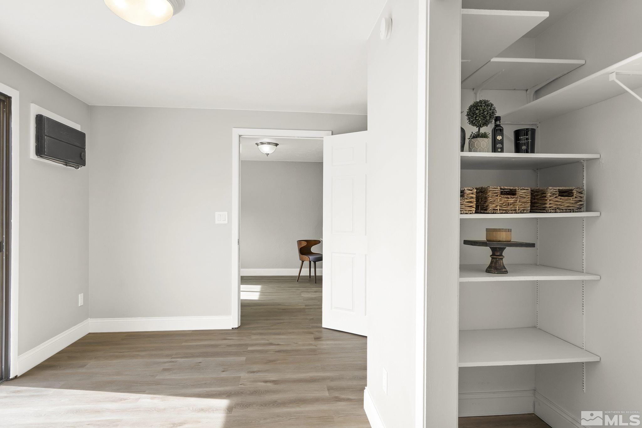 8895 Limnol Street Reno, NV 89506 - Photo 10 of 21 a view of a kitchen from the hallway with closet