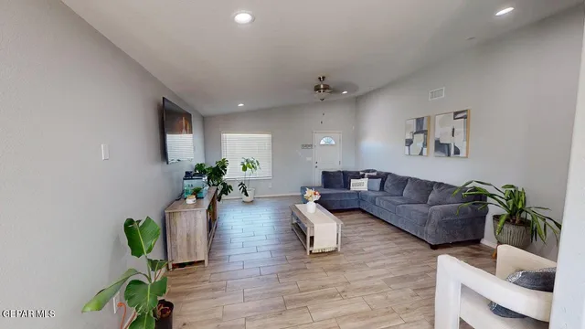 a view of a dining room with furniture and window