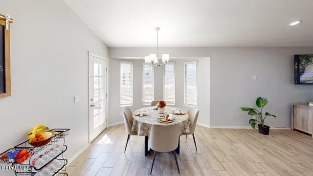 a kitchen with granite countertop a sink stove and refrigerator
