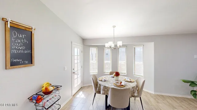a view of a livingroom with workspace and a window
