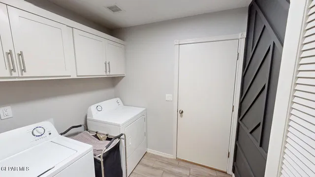 a bathroom with a tub shower vanity and a sink