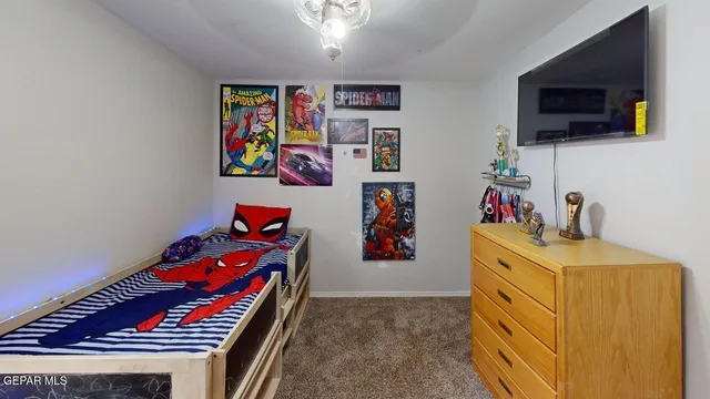 a picture of a bed in a small room