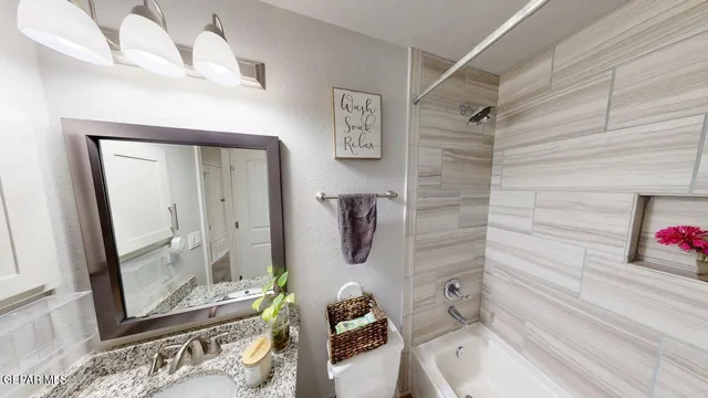 a view of swimming pool with seating area