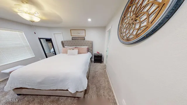 an aerial view of a house with a yard and lake view