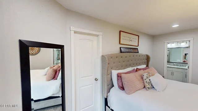 a view of a street with a house in the background