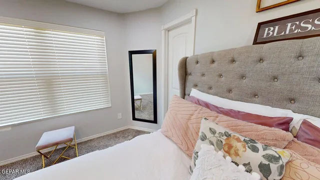 a room with gym equipment and a flat screen tv