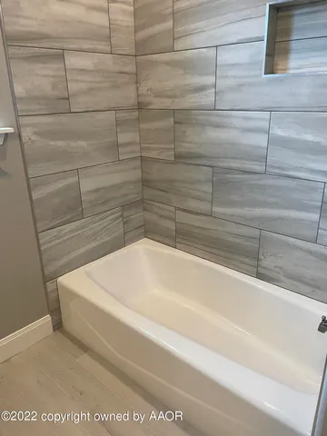 a bathroom with a granite countertop sink and vanity