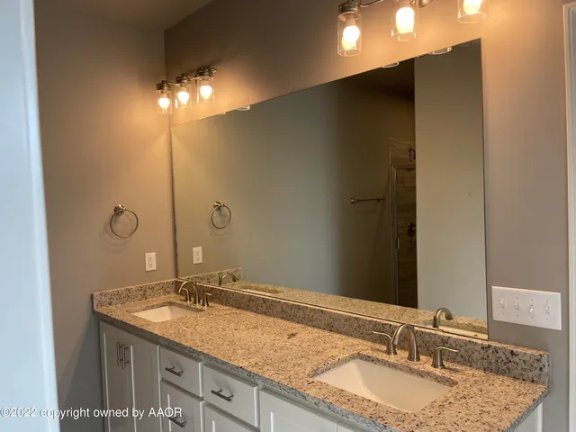 a bathroom with a bathtub and next to a window