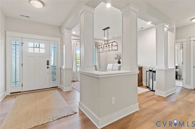 a view of kitchen with stainless steel appliances kitchen island sink and refrigerator