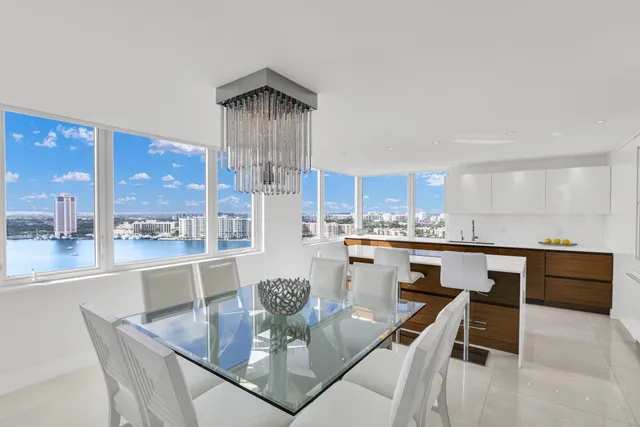 a dining room with furniture a window and kitchen view