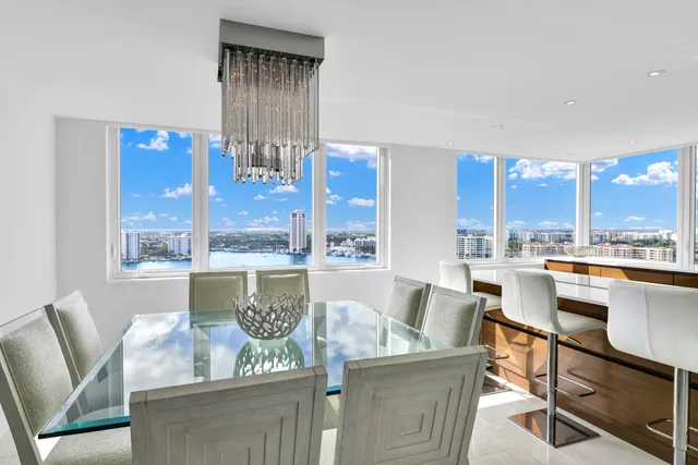 a bedroom with a bed and large window