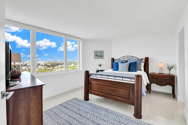 a spacious bathroom with a shower sink and mirror
