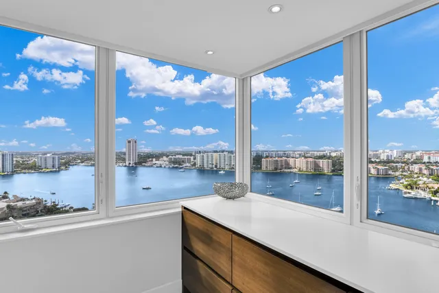 a kitchen with a sink and a large window