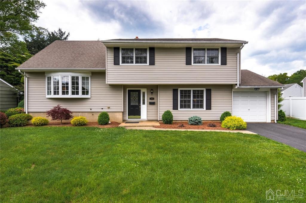 13 June Way Middlesex, NJ 08846 - Photo 1 of 22 a front view of the house with yard and porch