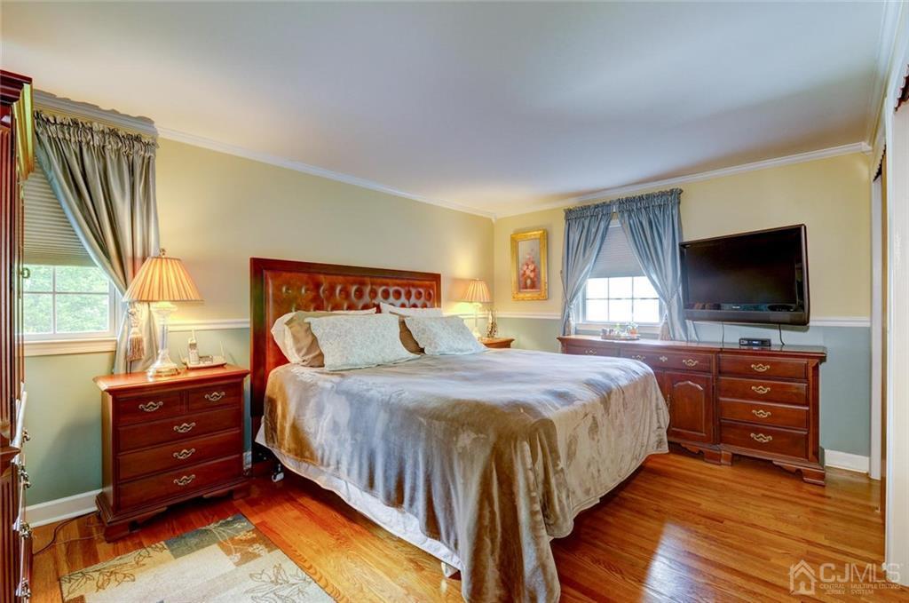 13 June Way Middlesex, NJ 08846 - Photo 14 of 22 a bedroom with a bed and a flat screen tv