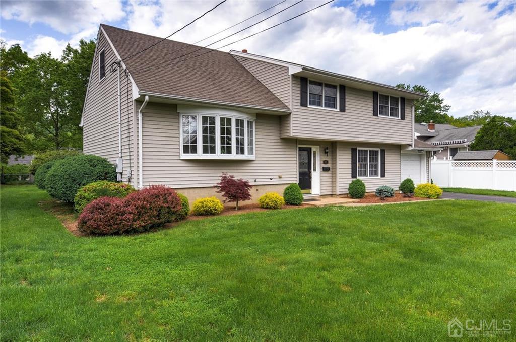 13 June Way Middlesex, NJ 08846 - Photo 2 of 22 a front view of house with yard and green space