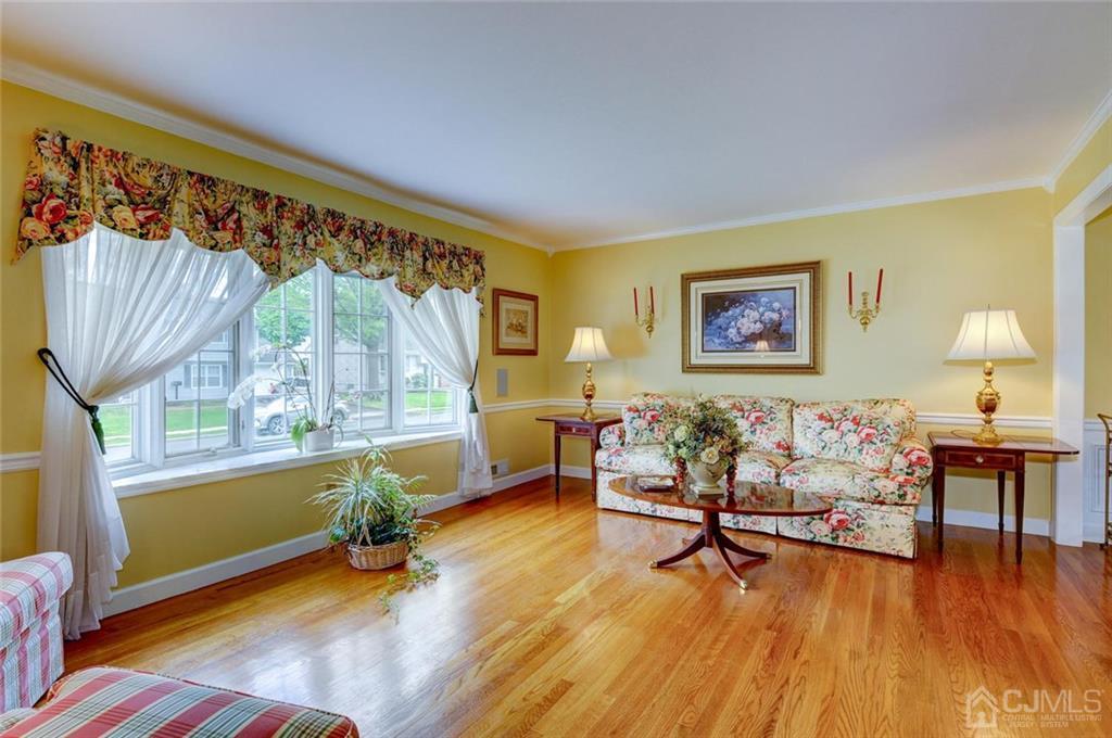 13 June Way Middlesex, NJ 08846 - Photo 4 of 22 a living room with furniture and a wooden floor