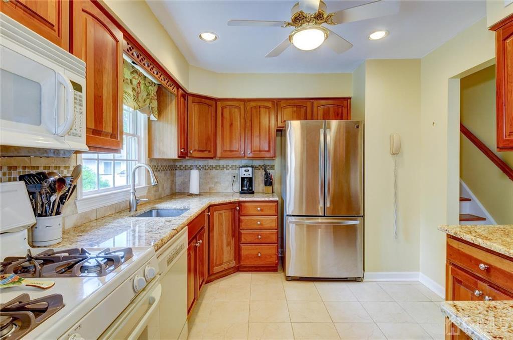 13 June Way Middlesex, NJ 08846 - Photo 9 of 22 a kitchen with stainless steel appliances granite countertop a refrigerator a stove and a sink with large cabinets
