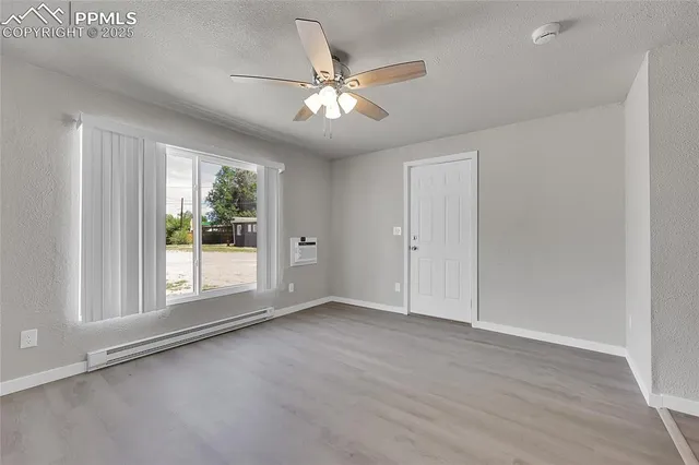 a kitchen with kitchen island white cabinets and white appliances