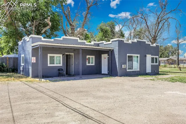 a front view of a house with yard