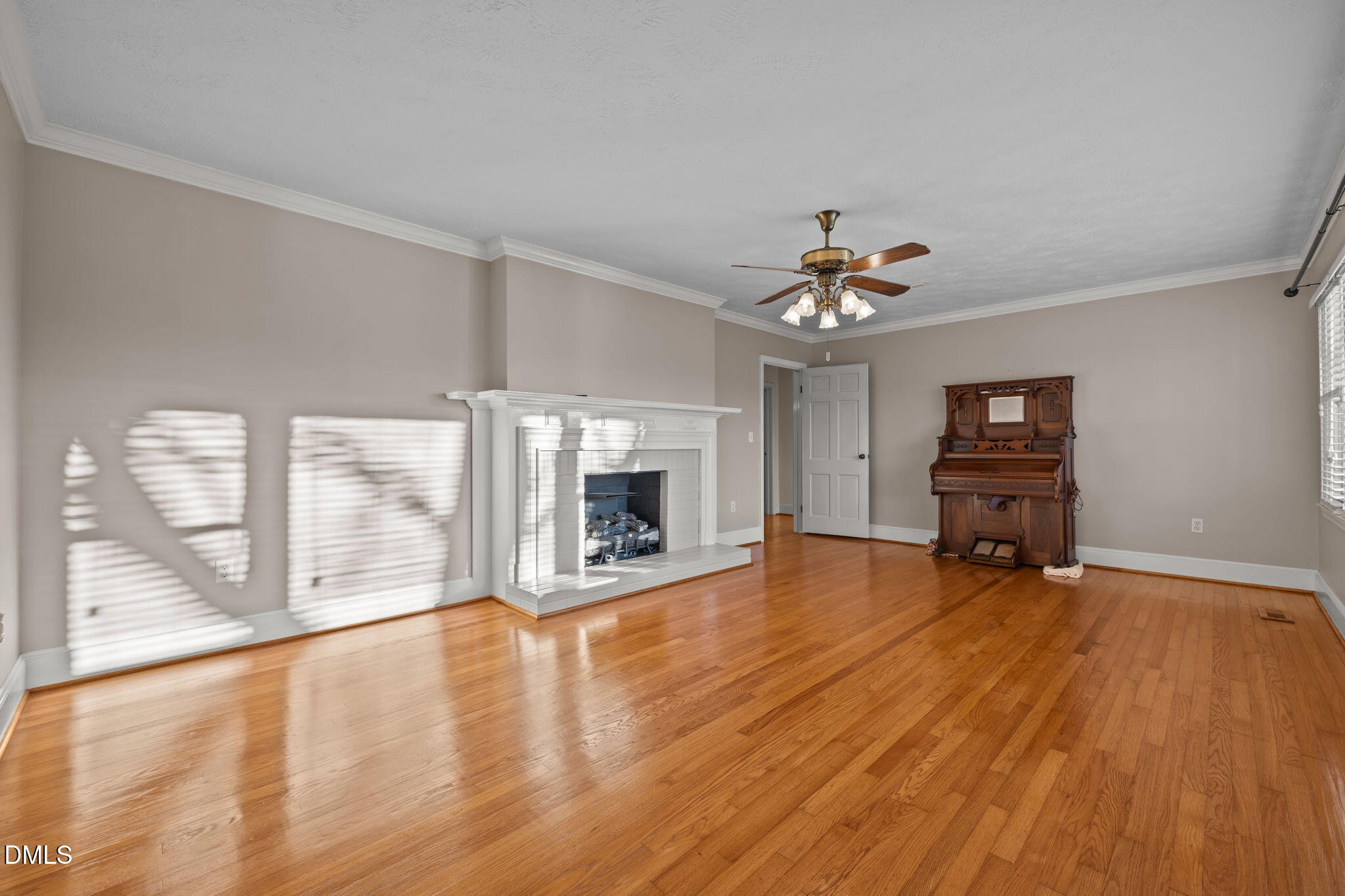 7111 Highway 401 Bunnlevel, NC 28323 - Photo 12 of 39 a view of an empty room with a window and wooden floor