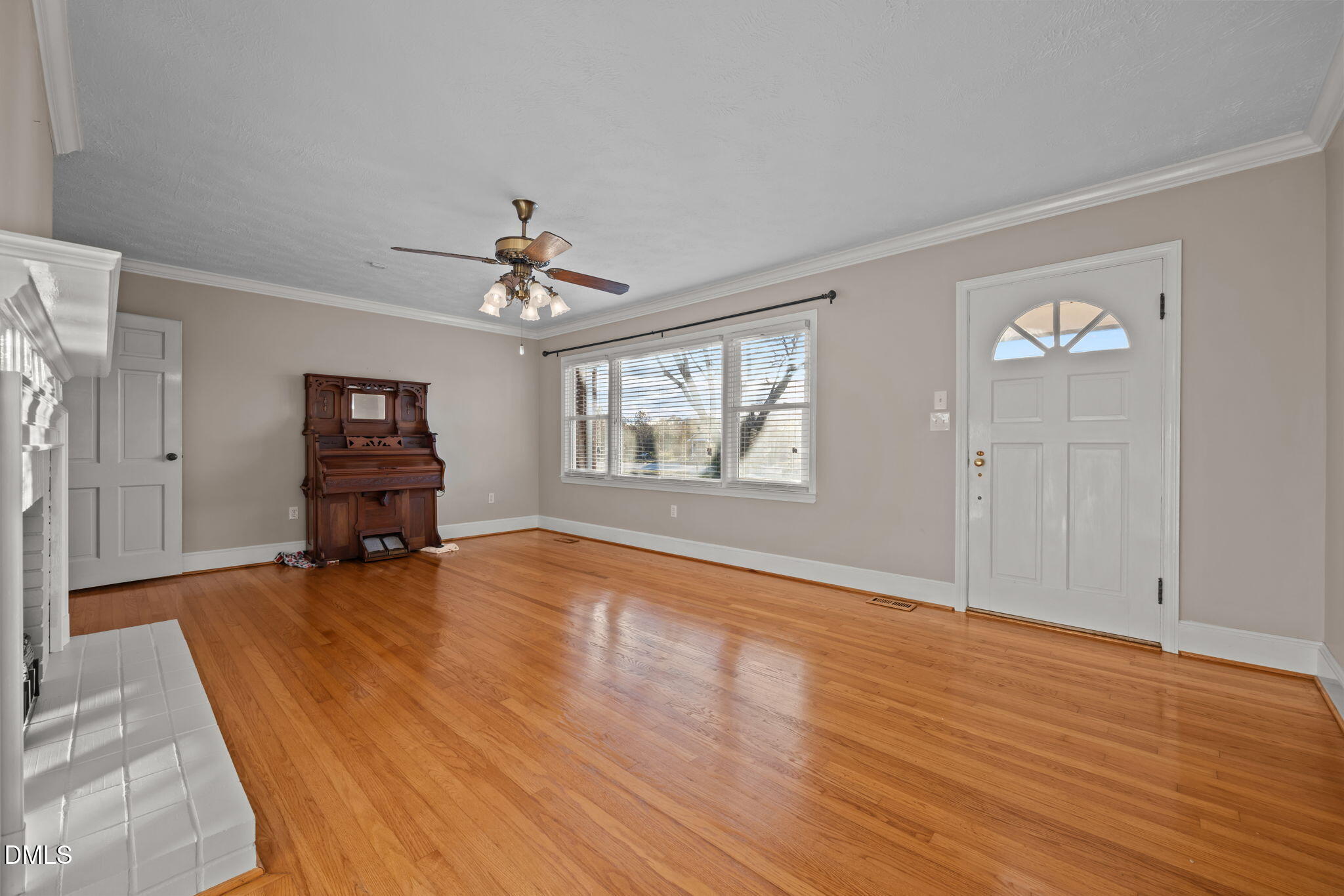 7111 Highway 401 Bunnlevel, NC 28323 - Photo 13 of 39 wooden floor in an empty room with a window