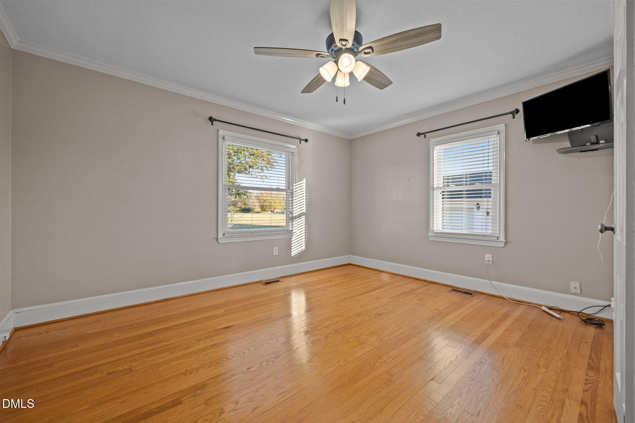 7111 Highway 401 Bunnlevel, NC 28323 - Photo 16 of 39 a view of an empty room with a window and wooden floor